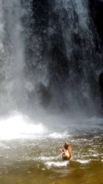 Karen Duquette in the water at Looking Glass Falls